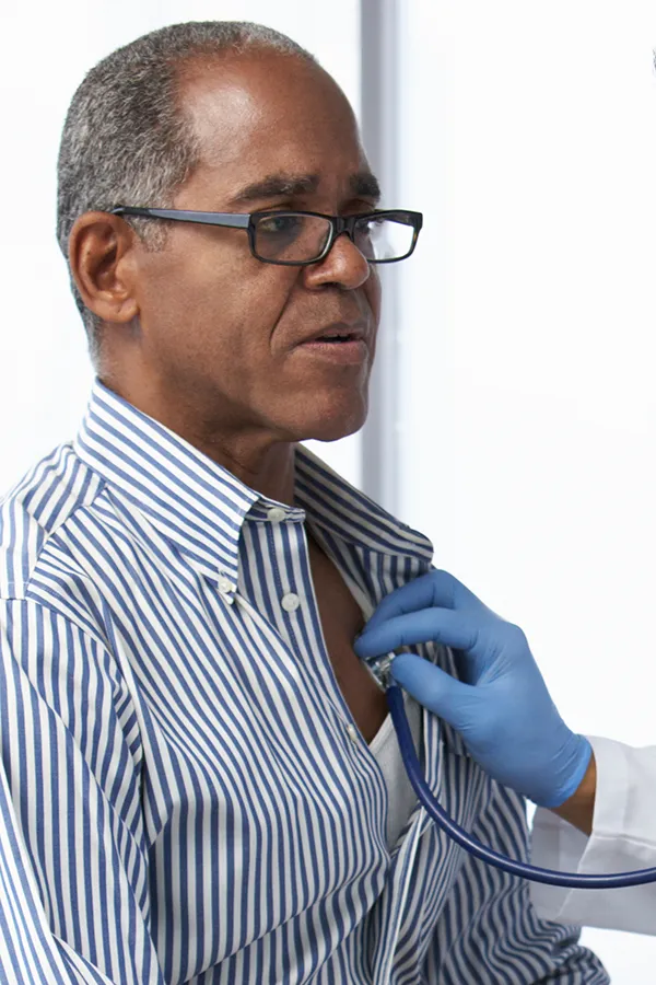 An older Black man gets his heartbeat checked. Get cardiovascular and lipid assessment from Morgan Burns, APRN in New Smyrna Beach.
