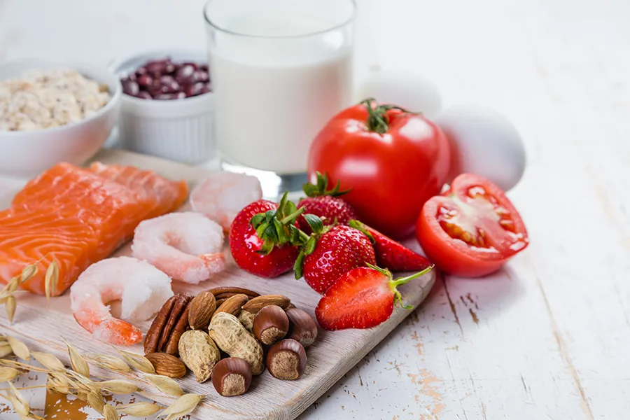 A board of foods like nuts, shellfish, and dairy, that are commonly associated with allergies. Get treatment for food allergies from Morgan Burns, APRN in New Smyrna Beach.