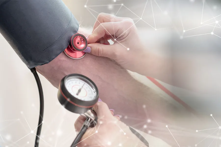 A man gets his blood pressure taken. Schedule hypertension treatment from Morgan Burns, APRN in New Smyrna Beach.