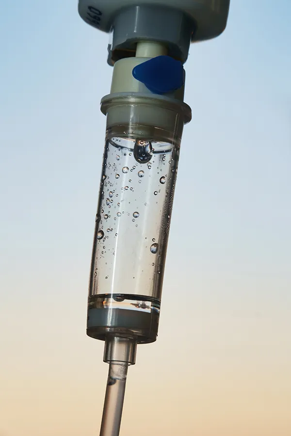 Close-up of an IV drip. Get ozone IV therapy from Brandi Terra, NP at Oak & Stone Wellness in San Diego.