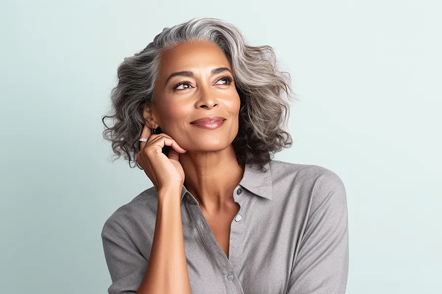 A middle-aged woman with beautiful skin. Schedule Radiofrequency Microneedling for Skin Tightening Treatment from Brandi Terra, NP at Oak & Stone Wellness in San Diego.